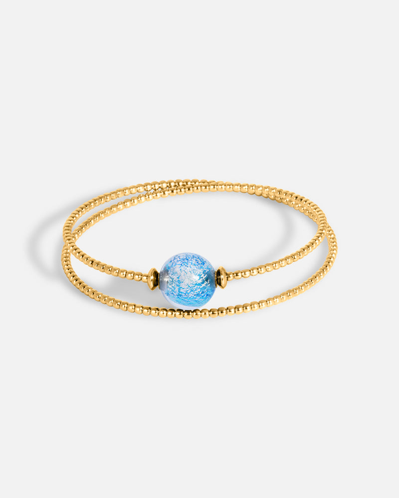 Liliflo_bijoux modulables swiss made_bracelet Milonga en double tour_couleur or jaune avec un Murano Zenith de couleur bleu aqua avec feuille d’argent