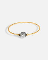 Liliflo_bijoux modulables swiss made_bracelet Milonga en simple tour_couleur or jaune avec un Murano Galaxie de couleur gris noir