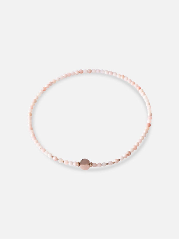 Liliflo, marque de bijoux interchangeable Suisse : collier limbo en couleur or rose - pierre semi-précieuse opale rose avec un lien illusion en acier or rose