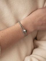Liliflo, Swiss Jewelry Brand : Austauschbares Element_silberfarbener Globus auf einem Armband Tango Double            